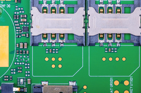 Part of the mobile phone circuit board with two SIM slots Close-up with selective focus and Shallow...