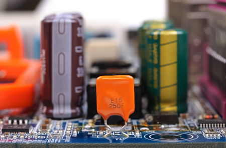 Part of PC mainboard with electronic components  Close-up with selective focus and shallow DOF 