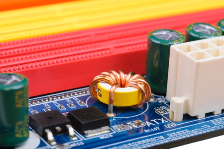 Part of PC mainboard with electronic components  Close-up with selective focus and shallow DOF 