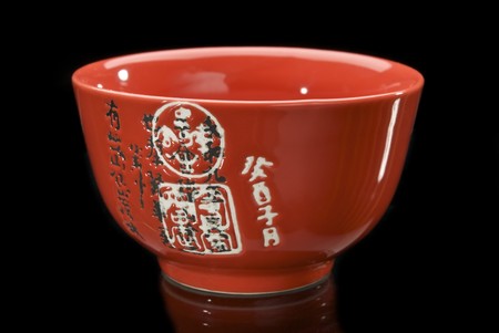 Red chinese teacup with hieroglyphsの写真素材