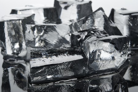 Clear ice cubes close-up. Isolated on light backgroundの写真素材