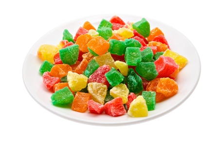 Sweet candied fruit on a saucer isolated on a white background の写真素材
