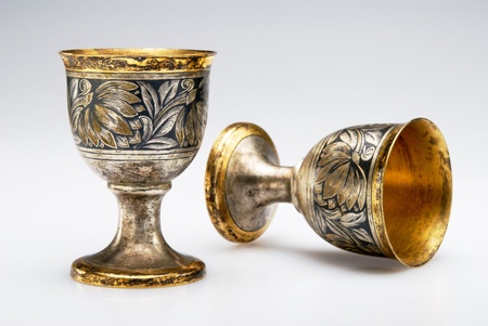 Two ancient wine cup isolated over white backgroundの写真素材