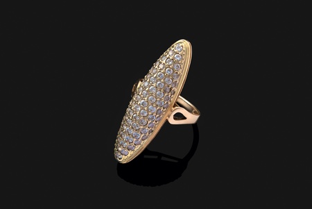 Golden ring with diamonds over black backgroundの写真素材