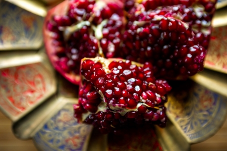Pomegranate on dish  Very low fields of depthの写真素材