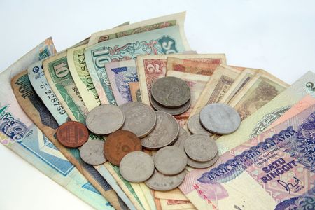 Business concept - with many notes & coins of different countries
