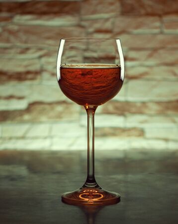 glass of wine in the backgroundの写真素材