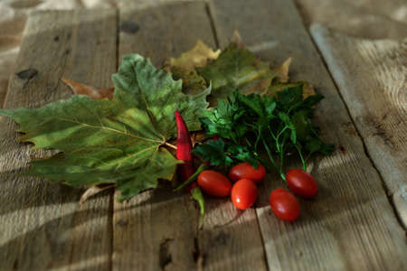 tomatoes on wooden backgroundの写真素材