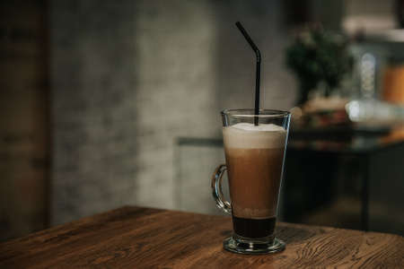 cappuccino in glass cup on tableの写真素材