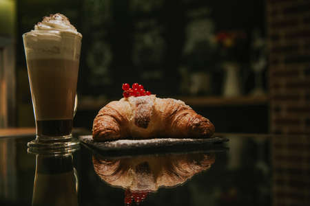 croissant with cream and cappuccinoの写真素材