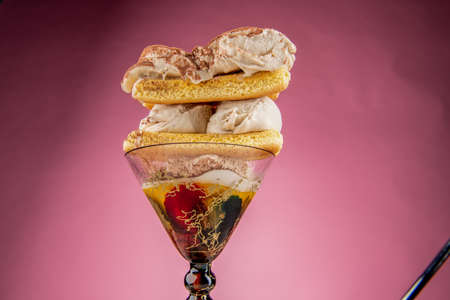 glass cup with cream and biscuits