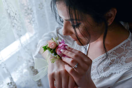 bride holding a bouquet of roses