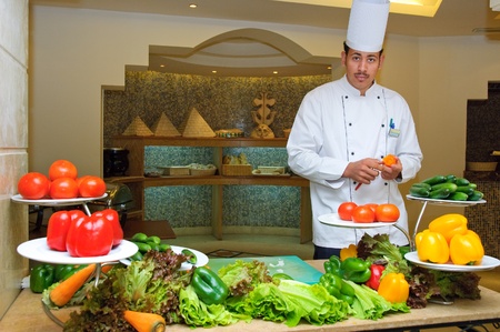 Egypt. 2010. The cook offers vegetables in restaurantのeditorial素材