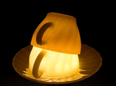 Turned ceramic cups illuminated from belowの写真素材