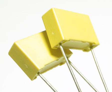 Two yellow high voltage capacitors.
