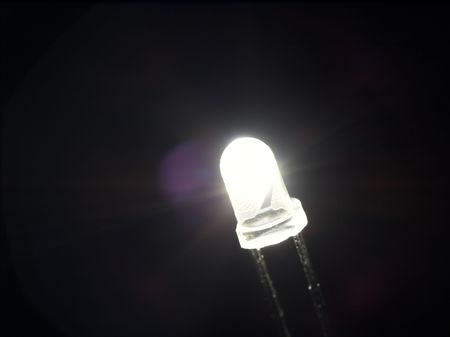 Halo around white lighting LED, isolated on black background.の写真素材