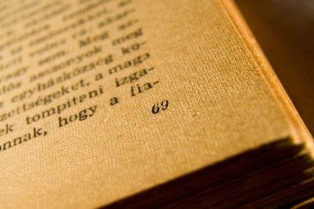 An old book, opened on page 69, shallow DOF, weird language(hungarian)の写真素材