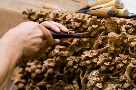 Hands engraving woodの写真素材