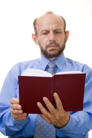 Businessman reading a book, focused on the bookの写真素材