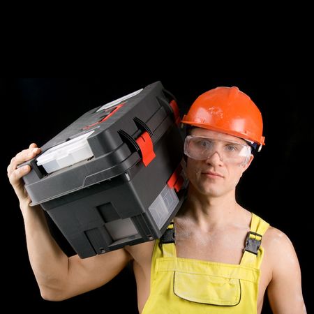 Construction worker covered with dust, isolated on black