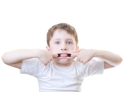 A boy making faces, isolated on whiteの写真素材
