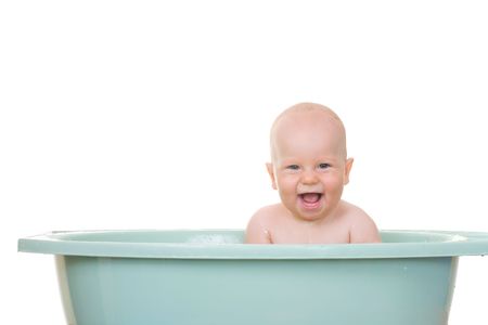 An 8 month boy bathing, isolated on white