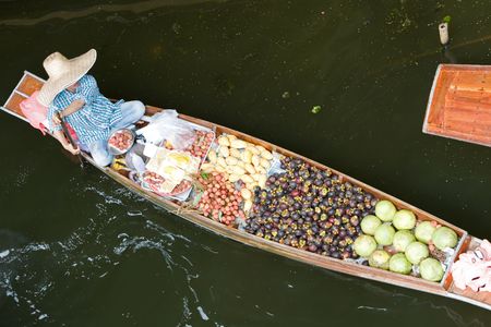 A photo of a trader on floating marketの写真素材