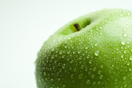 Photo of a green apple perfused waterの写真素材