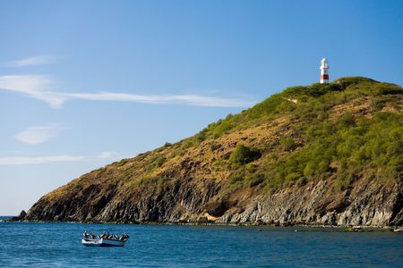 of a lighthouse on a hill and sea landscapeの写真素材