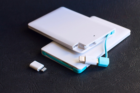 power bank small, mini size on black background