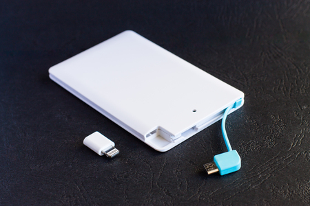 power bank small, mini size on black backgroundの写真素材