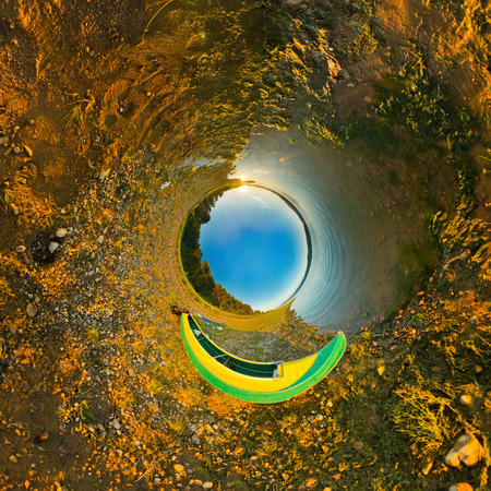 kayak on river coast. Stereographic panorama, a little planet
