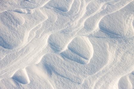 background snow waves at sunset by windの写真素材
