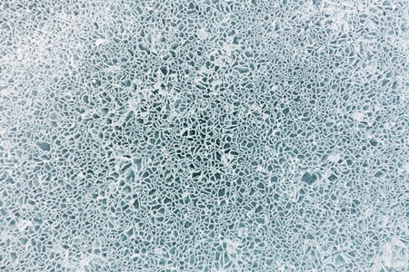 Net pattern of cracks on blue ice of Lake Baikalの写真素材