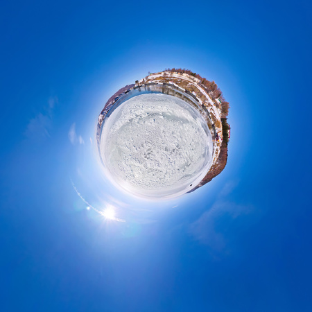 The snow on the ice lake baikal at the pier from which the ship sails in Listvyanka, the Angara River estuary.の写真素材