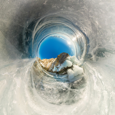 Rock on Olkhon covered with ice and icicles in Lake Baikal in winter. Polar little planet.の写真素材