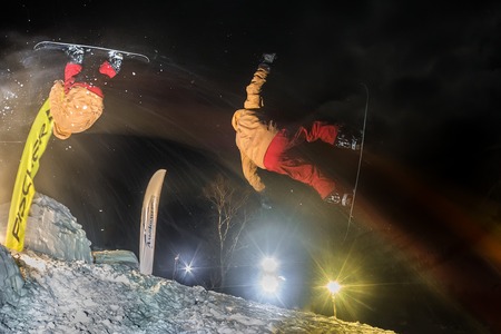 Mamay, Russia - December 10, 2016: Competitions freeride Mamay First Snow 2016 mountain near Mamay, on Lake Baikal in December 2016. Jumping freestyle contest participant. Denis Vikulovのeditorial素材