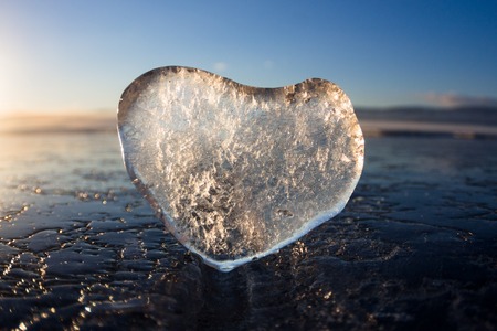 Icy heart in a crack in the light of sunset. lake Baikal.の写真素材