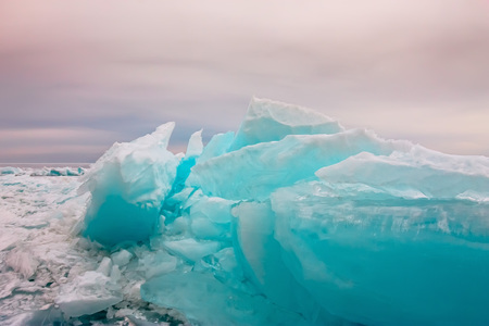 Arctic blue glacier ice hummock in cloudy weather.の写真素材