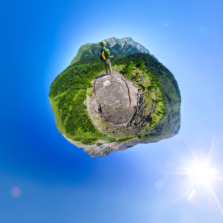 Spherical panorama 360 180 man with backpack standing in mountains.