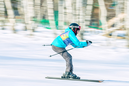 Irkutsk, Russia - February 12, 2017: Slalom competition snowboarding and skiing for adults and children in Irkutsk on the ski base in Akademgorodok Academy Cup in 2017のeditorial素材