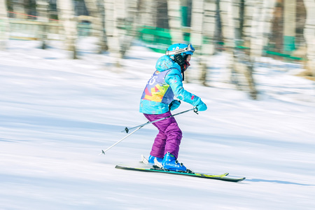 Irkutsk, Russia - February 12, 2017: Slalom competition snowboarding and skiing for adults and children in Irkutsk on the ski base in Akademgorodok Academy Cup in 2017のeditorial素材