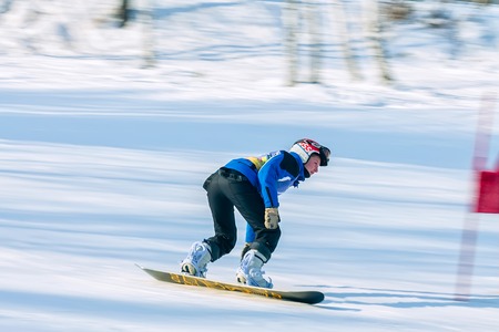 Irkutsk, Russia - February 12, 2017: Slalom competition snowboarding and skiing for adults and children in Irkutsk on the ski base in Akademgorodok Academy Cup in 2017のeditorial素材