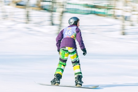 Irkutsk, Russia - February 12, 2017: Slalom competition snowboarding and skiing for adults and children in Irkutsk on the ski base in Akademgorodok Academy Cup in 2017のeditorial素材