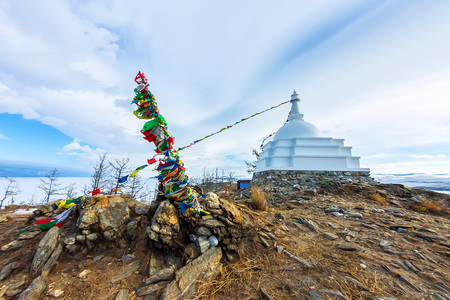 Buddhist stupa of enlightenment on the island Ogoy with flags. Bの写真素材