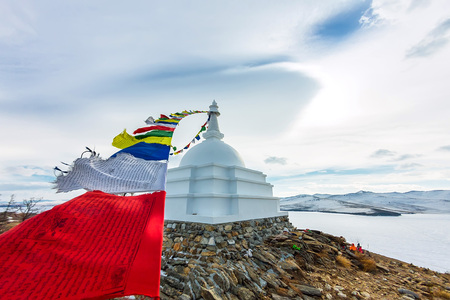 Buddhist stupa of enlightenment on the island Ogoy with flags. Bの写真素材