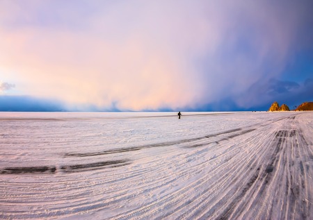 The road on the ice of Lake Baikal, to the Cape Shamanka, on the island of Olkhon.の写真素材