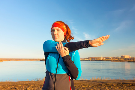 Morning gymnastics of athletic woman for run