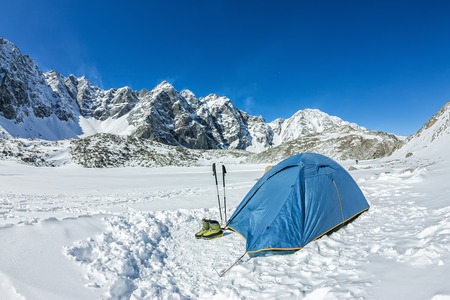 Blue tent in the base camp in the mountains.の写真素材