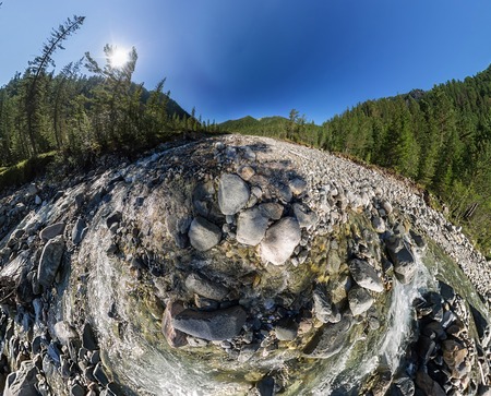 Wide Aero panorama mountain river flows into the forest between the stones..の写真素材